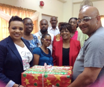 presenting a gift to the teachers of the Shekinah Christian Academy